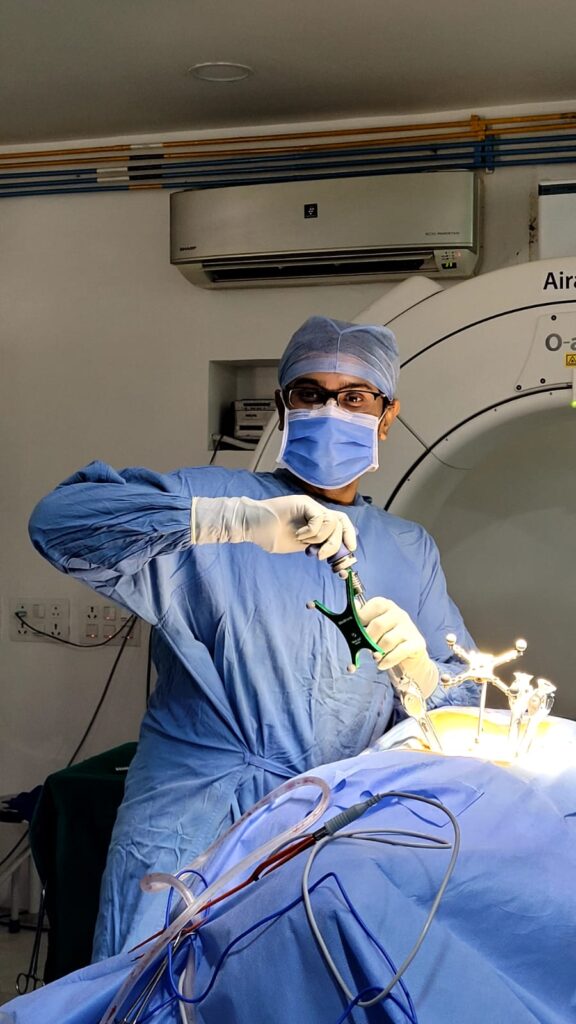 Dr. Mrugank Narvekar performing minimally invasive spine surgery with O-arm intraoperative navigation